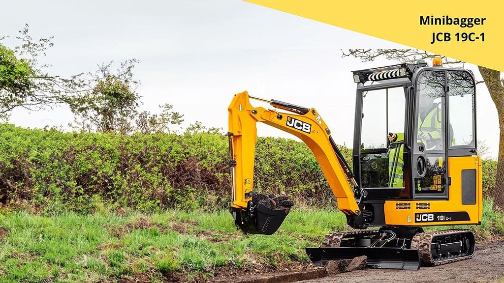 Minibagger-2.jpg Der Minibagger baggert ein Loch am Rand einer Straße. - Minibagger selber fahren in Wuppertal